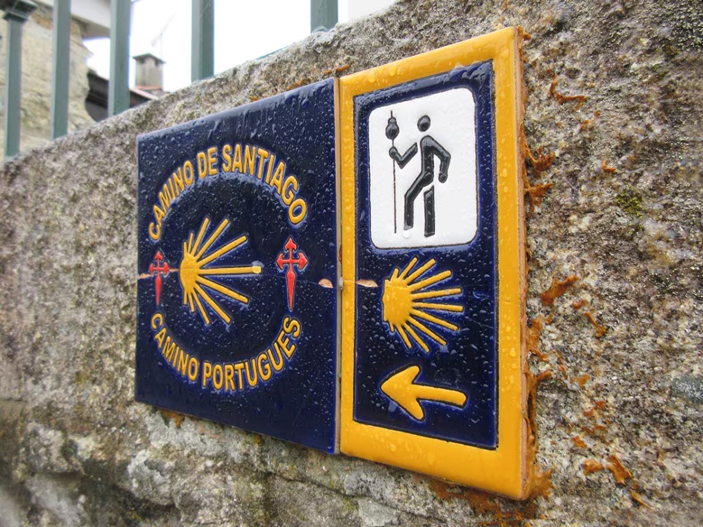 Many sections of the Camino de Santiago are marked with signs bearing the iconic Scallop Shell.